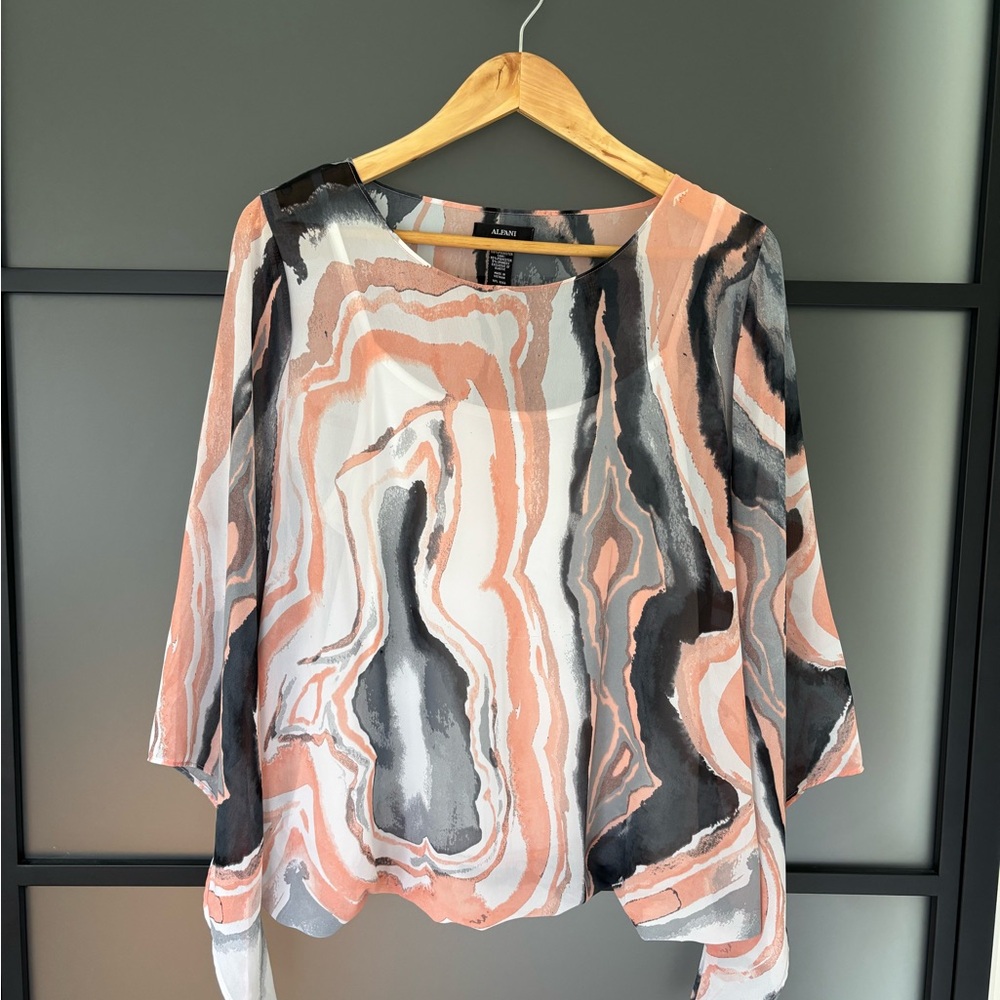 Elegant Women's Top in Black, White, and Peach size medium